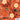 Tropical pattern with palm leaves, flowers, and helicopters on an orange background with 'Island Style Clothing' branding.