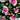 Close-up of Red Hill Creative - Melon Malarkey fabric design with pink watermelon slices and yellow flowers on black, used in custom shirts and hats.
