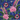Close-up of US Navy, San Diego USA | Custom Military Shirt fabric showing pink tropical flowers, green leaves, and military emblems on a blue background.