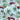Close-up of Walker Fire Department tropical shirt fabric featuring red fire trucks, palm trees, white hibiscus flowers, and mountain accents.