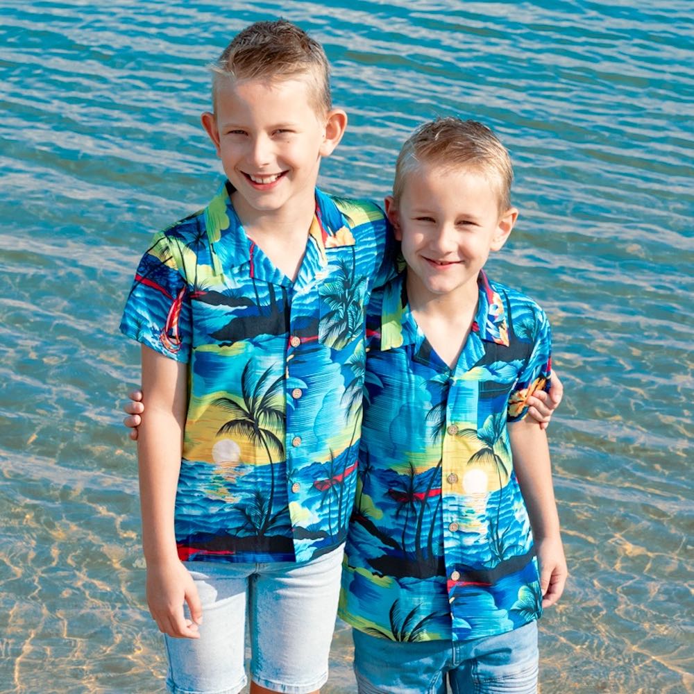 Swoop on this season's must-have! These shirts are going to make the perfect addition to your little boy's wardrobe.  A modern tropical shirt made from a breathable and lightweight rayon material makes them perfect for your little grom wearing them in the hot summer months.  Matching shirts for Mum & Dad are available. View the Blue Sunset Collection.