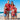 a family wearing matching red hawaiian xmas shirts on the beach