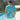 Back view of men's Christmas Pool Party shirt showing full tropical print with Santa, palm trees, and drinks on aqua blue background.