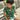 Boy sitting outdoors in Holidaze Kids Unisex Festive Shirt with holiday-themed prints, part of kids Hawaiian Christmas shirts collection.