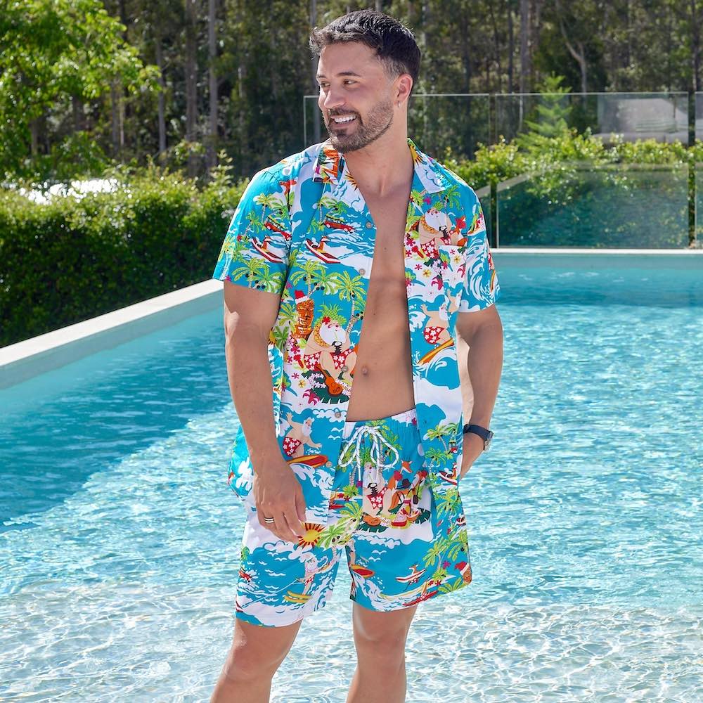 Stay cool and stylish this holiday season with the Blue Surfing Santa Hawaiian Shirt & Shorts! This unique men's outfit features a festive Hawaiian shirt and shorts combo that features a charming print of Santa surfing on some fun waves. Don't miss out on this perfect Christmas look!