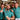 Three men in matching teal shirts with colorful patterns and 'Tiny' logo in a brewery setting.