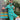 Person wearing a matching turquoise pajama set and face mask with a 'Kaiju Krush' theme, standing outdoors.