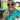 Person wearing a colorful shirt and sunglasses holding a can of 'Kaju Krush' with 'Island Style Clothing' branding.