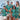 Family wearing matching Coco Crush Hawaiian outfits including mens shirt, womens dress, and kids shirts with tropical teal print.