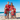 Family wearing Aussie Christmas Red matching outfits with tropical Christmas prints, perfect for beach holidays and festive family photoshoots.
