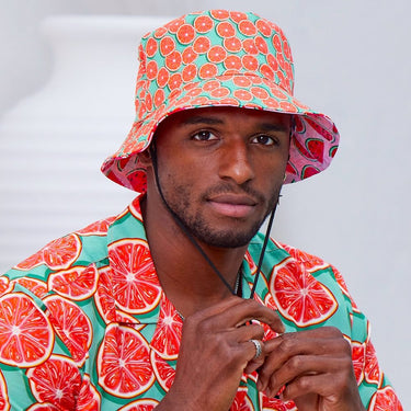 Bringing you the perfect way to top off your show-stopping Festival 'fit. Get two for the price of one with our reversible bucket hats. One side is our Groovy Grapefruit and the other side is our Shake Ya Melons. Pimm's o'clock is approaching; you pour, we've prepped the fruit. Level up the look with matching Shirts and Shorts. View the Groovy Grapefruit Collection. ONE SIZE - 60cm Circumference