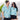 Smiling couple wearing matching Under The Sea Hawaiian shirts with seashell and anchor prints, perfect for tropical hospitality uniforms.