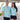 Couple laughing in coordinated Under The Sea Hawaiian shirts featuring starfish and crab prints, great for resort or cruise staff uniforms.