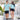 Couple holding hands in matching Under The Sea Hawaiian shirts with nautical motifs, stylish cruise wear or beachside hospitality attire.