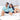 Couple lounging in matching Under The Sea mens & womens Hawaiian shirts with ocean-themed prints, ideal for cruise wear or hospitality uniforms.
