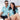 Happy couple wearing Under The Sea Hawaiian shirts with ocean-inspired prints, ideal for couples sets or tropical hospitality uniforms.