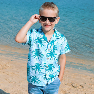 Make sure your little ones are the center of attention with the Island Blues Kids Unisex Hawaiian Shirt! Featuring fun palm tree prints on 100% cotton, this is perfect for all their summer and cruisin' adventures (don't forget to get the matching items for the whole family!). Get ready to party under the palms! View the Island Blues Collection.