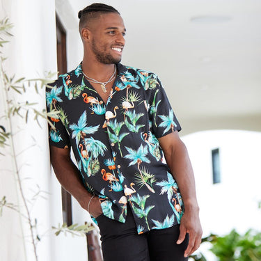 The perfect party shirt! It's cool and comfortable with a stand out flamingo and palm trees print on a black base. Double up with the matching shorts. Take your look to the next level by adding matching Shorts, Kaftans, and Crop Shirts. View the Flamingo Nights Collection.