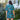 Person wearing a colorful tropical patterned shirt in an outdoor setting