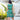 Back view of womens Coco Crush Hawaiian dress showing detailed tropical print with pineapples, coconuts, and flowers on teal fabric.