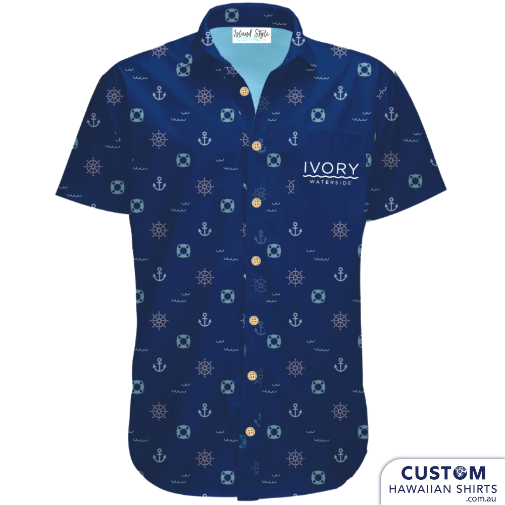 A Stein of good taste.. this understated nautical number for Ivory Waterside Hotel is certainly see-worthy. A customized arrangement of anchors, waves and lifebuoy rings amid a deep blue background, this look has an unadorned sophistication. Sharp Custom Hospitality Hawaiian Shirt Uniforms. 