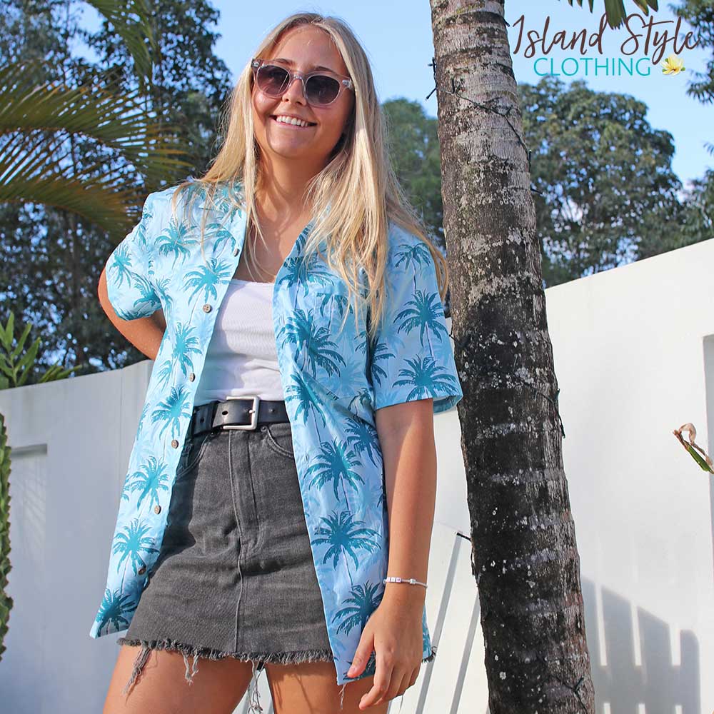 Let yourself feel the island vibes with this unique blue aloha shirt. The classic Hawaiian pattern with palm trees will have you feeling like a beachcomber even in corporate headquarters!  100% cotton ensures a comfortable fit for all day wear, whether you’re heading out on a cruise or to the office. It's truly a shirt "to-tally" worth getting your hands on!