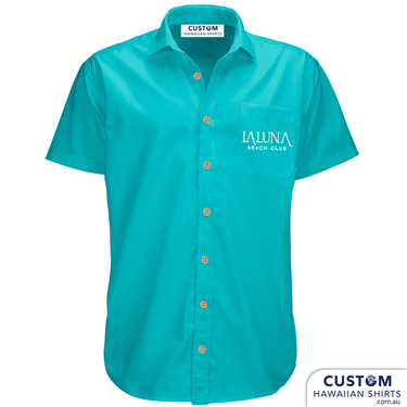 Bar and Hotel staff shirts custom-designed hospitality uniforms for La Luna Beach Club, GC. These personalised Hawaiian shirts were plain with their logo on the pocket.  Custom Hospitality Shirts 100% Cotton Open collar Logo on pocket Blue & Tan version Coconut buttons Free design by our in-house designers on Sunny Coast