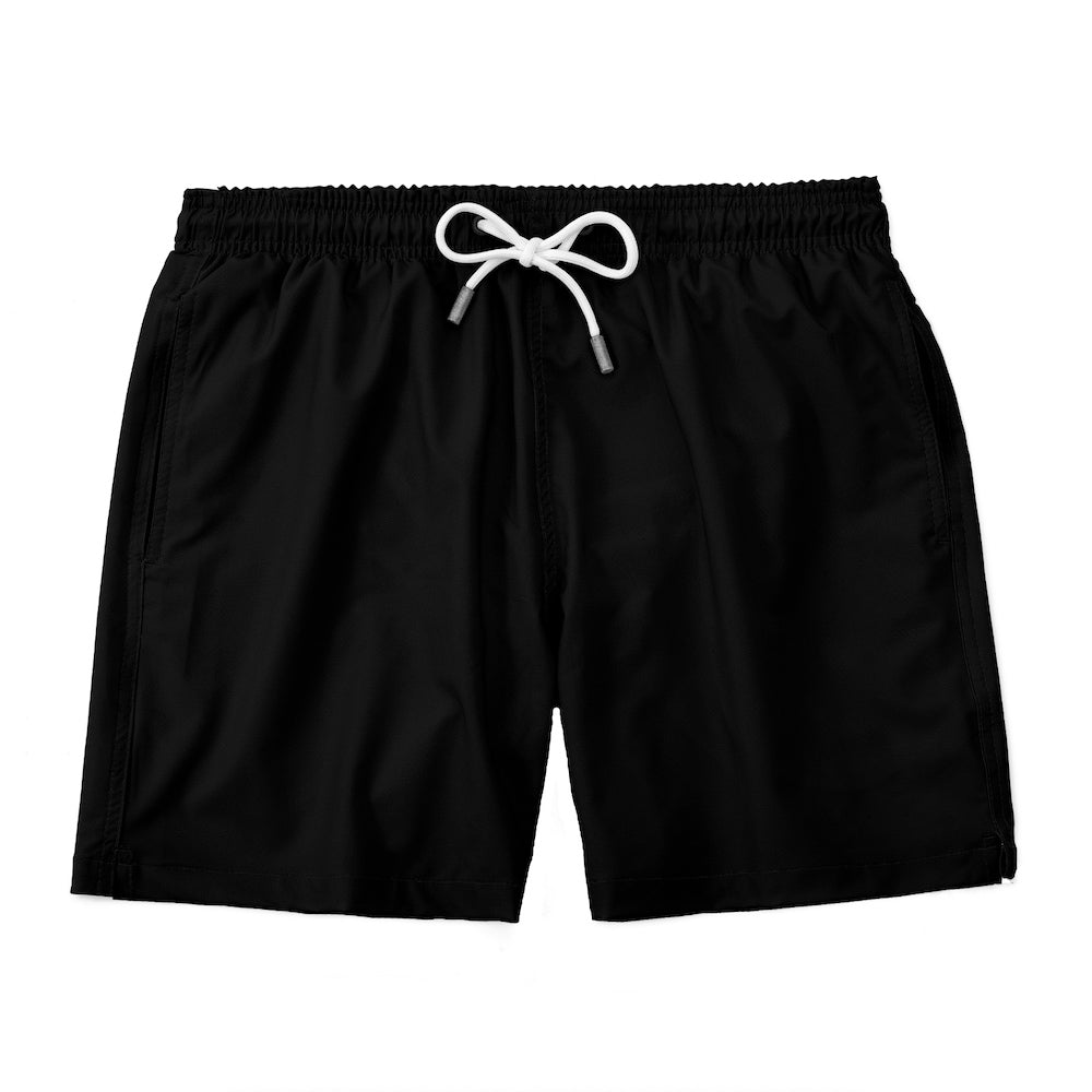 Bring style and sustainability to the beach with Midnight Oasis - Black Recycled Swim Shorts. Made from recycled materials, these shorts are perfect for the eco-conscious adventurer. With a sleek black design, you'll stay trendy while saving the planet. Dive into the Midnight Oasis and make a splash with a clear conscience.