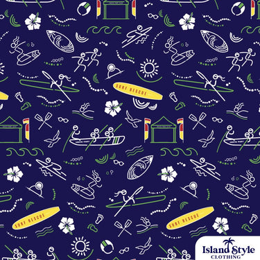 Close-up of South Port SLSC custom shirt fabric featuring colorful surf rescue illustrations, club huts, and tropical motifs on a navy background.