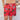 a woman in a xmas top and red shorts