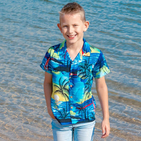Swoop on this season's must-have! These shirts are going to make the perfect addition to your little boy's wardrobe.  A modern tropical shirt made from a breathable and lightweight rayon material makes them perfect for your little grom wearing them in the hot summer months.  Matching shirts for Mum & Dad are available. View the Blue Sunset Collection.