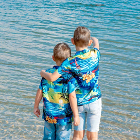 Swoop on this season's must-have! These shirts are going to make the perfect addition to your little boy's wardrobe.  A modern tropical shirt made from a breathable and lightweight rayon material makes them perfect for your little grom wearing them in the hot summer months.  Matching shirts for Mum & Dad are available. View the Blue Sunset Collection.