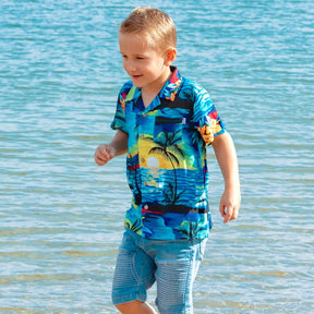 Swoop on this season's must-have! These shirts are going to make the perfect addition to your little boy's wardrobe.  A modern tropical shirt made from a breathable and lightweight rayon material makes them perfect for your little grom wearing them in the hot summer months.  Matching shirts for Mum & Dad are available. View the Blue Sunset Collection.
