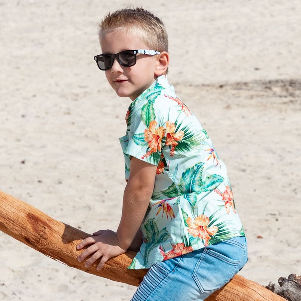 Treat your little one to some summertime fun with the Green Paradise - Kids Unisex Hawaiian Shirt. Made with 100% cotton and totally tropical print, it’s the perfect way to send them off for cruises and casual adventures.  Plus, you can even coordinate the whole fam with matching items! Aloha, summertime! View the Paradise Collection. 
