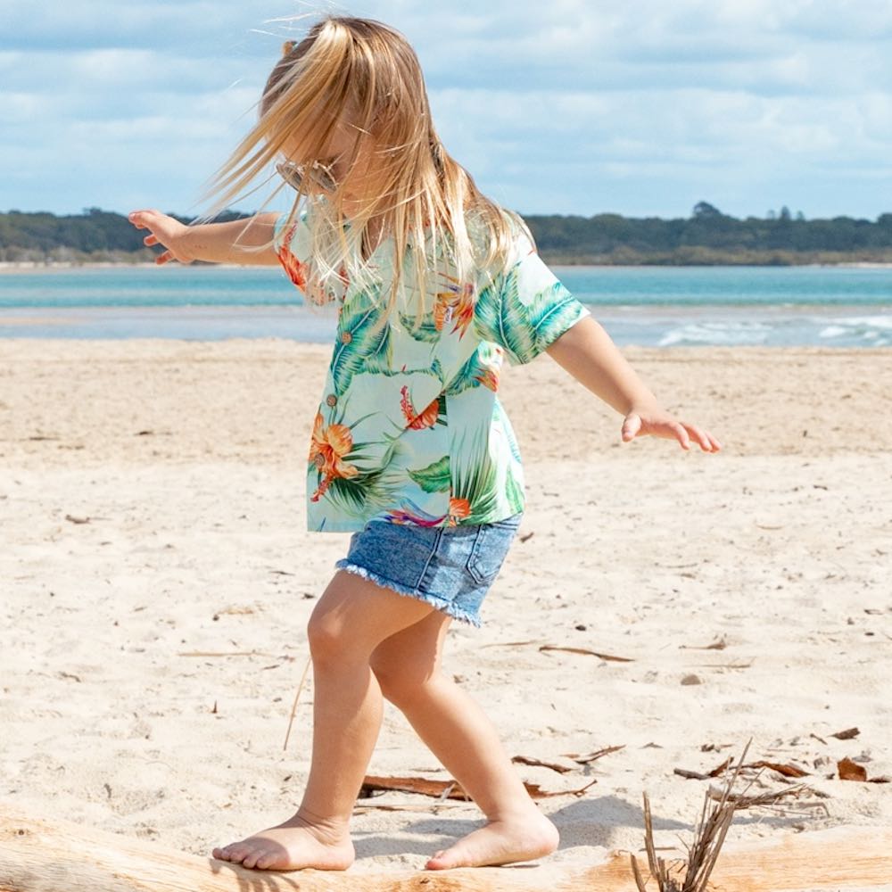 Treat your little one to some summertime fun with the Green Paradise - Kids Unisex Hawaiian Shirt. Made with 100% cotton and totally tropical print, it’s the perfect way to send them off for cruises and casual adventures.  Plus, you can even coordinate the whole fam with matching items! Aloha, summertime! View the Paradise Collection. 