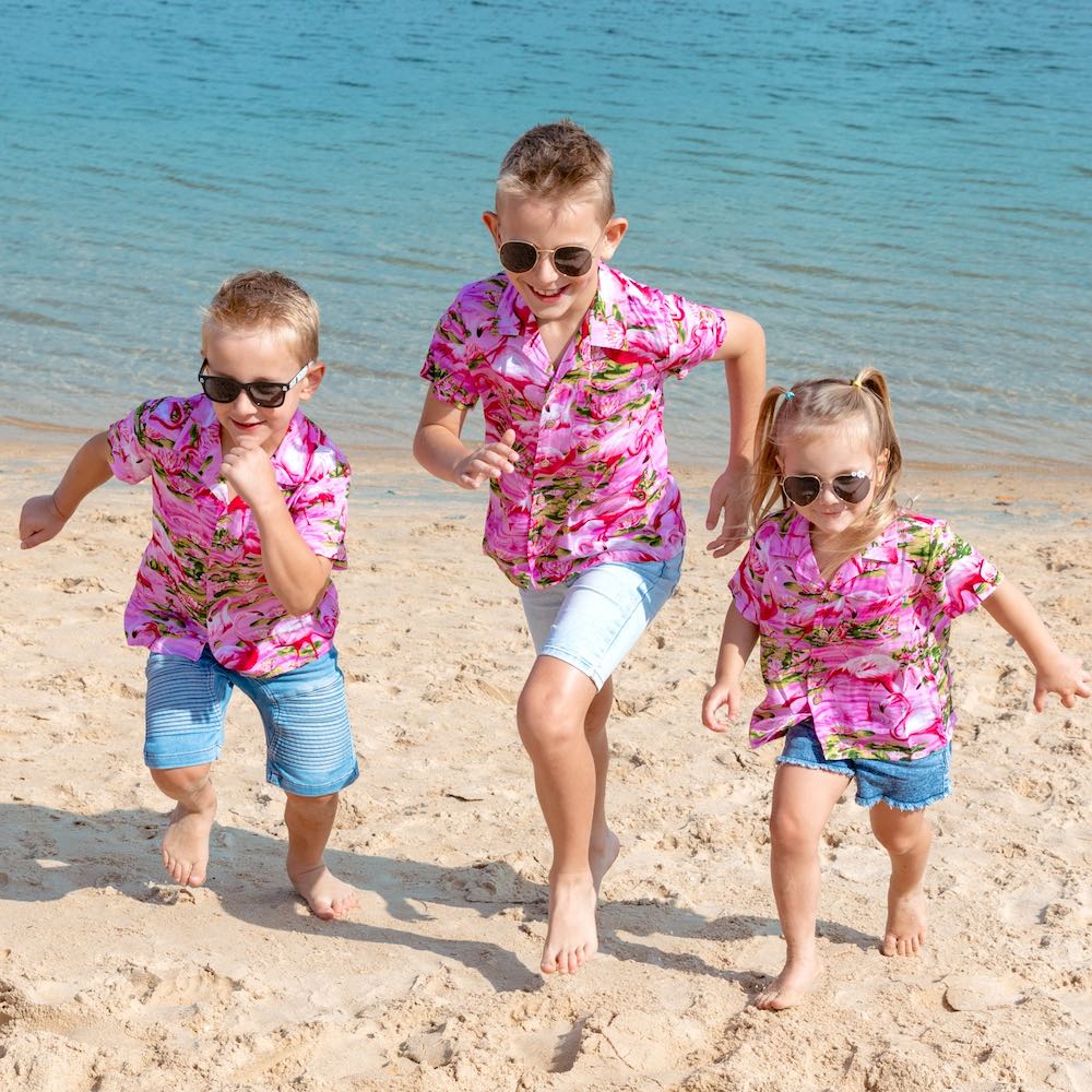 Put a smile on your kids' faces and let them “flamingle” with this Pink Flamingo Kids Unisex Hawaiian Shirt! Featuring eye-catching pink flamingos on a pink base, this soft rayon shirt is perfect for summer fun and cruisewear.  Get the matching items for the whole family and create a coordinated look! View the Pink Flamingo Collection. 