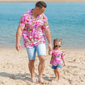 Put a smile on your kids' faces and let them “flamingle” with this Pink Flamingo Kids Unisex Hawaiian Shirt! Featuring eye-catching pink flamingos on a pink base, this soft rayon shirt is perfect for summer fun and cruisewear.  Get the matching items for the whole family and create a coordinated look! View the Pink Flamingo Collection. 