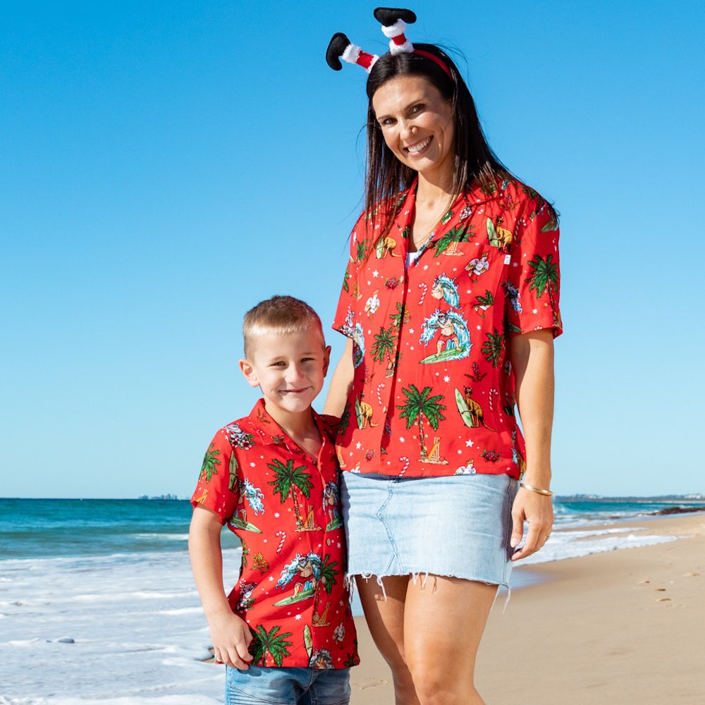 Make Christmas one to remember with our Aussie Christmas Red Festive Shirt! Perfect for all your little mini-mes, this unisex 100% rayon shirt features a red base with a fun surfing santa, aussie animals and flowers motif. Ho ho ho!