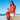 a woman standing next to a boy on a beach
