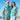 a man and a woman standing on a beach Christmas shirts