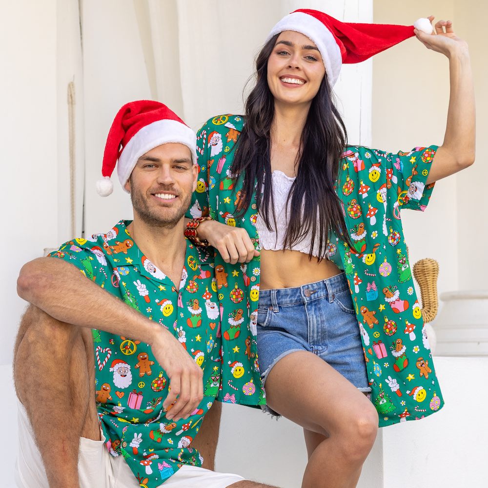 Stay festive all season long in the Holidaze shirt! Crafted from a soft rayon material, it merrily blends colourful, retro Christmas elements – from gingerbread to Santa to candy canes – all atop a festive green base. Make the holidays bright with it!