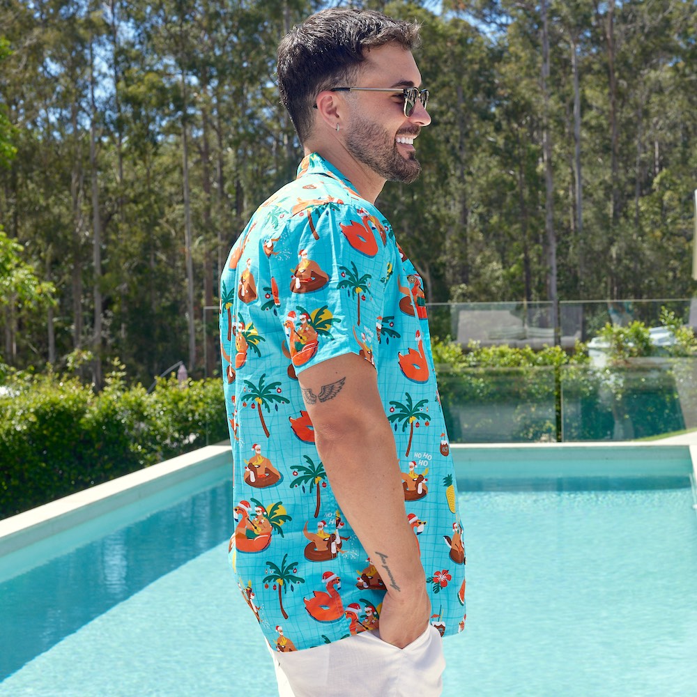 Looking for a shirt to make a splash this holiday season? The Christmas Pool Party shirt is perfect for guys who love to take the plunge in style! Crafted from quality 100% cotton, this festive shirt features Santa sippin' on some cocktails, surrounded by pool floaties and reindeer - plus, we even have the matching shirts for the whole fam! Dive in!