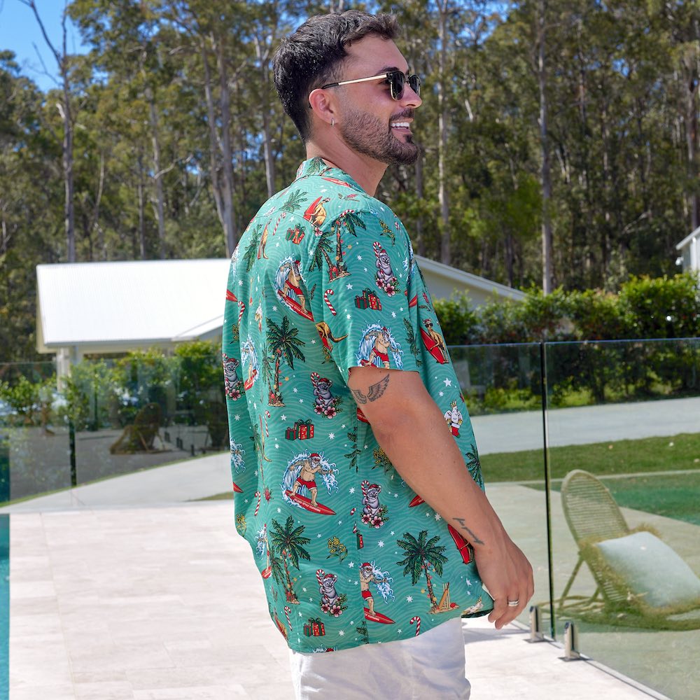 Leave the turkey carving to someone else, you'll be carving up the scene. Our crowd-pleasing 'Aussie Christmas Hawaiian Shirt' was so popular we also made it this year in red. This is Santa in all his festive glory, kicking back and hitting the waves on his time off. No snowflakes, just bold Australian animals and native Australian flora!  