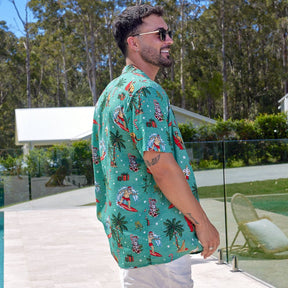 Leave the turkey carving to someone else, you'll be carving up the scene. Our crowd-pleasing 'Aussie Christmas Hawaiian Shirt' was so popular we also made it this year in red. This is Santa in all his festive glory, kicking back and hitting the waves on his time off. No snowflakes, just bold Australian animals and native Australian flora!  