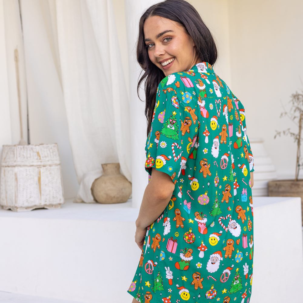 This Holidaze shirt is sure to turn heads and spark joy! You'll be the envy of the party in this 'groovy' 100% soft rayon shirt, boasting a vibrant green base and retro-inspired Christmas elements like Santa, gingerbread and of course lots of smiley faces! Deck the halls and your wardrobe!