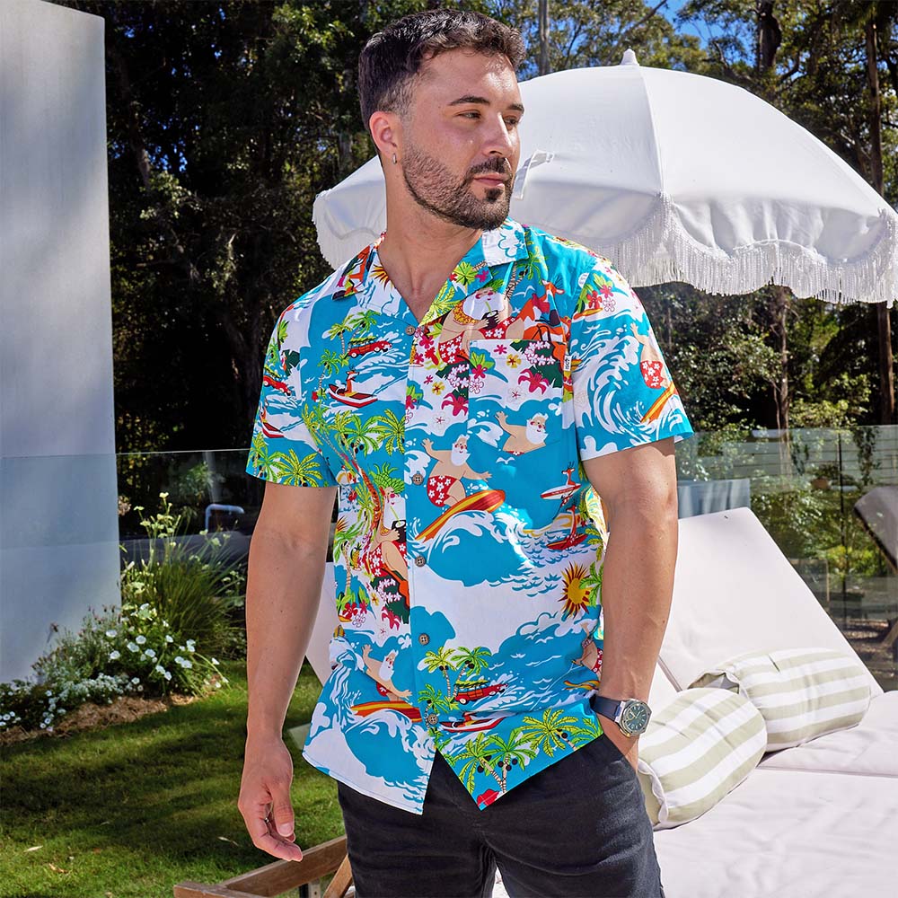 Never be a wave off from holiday fun with this Blue Surfing Santa shirt! This 100% cotton shirt is prepared to keep you cool in the Aussie heat...while keeping you totally rad with holiday cheer. Show off your festive spirit with Santa and his reindeer catching some waves! It's the perfect way to show up matching with the whole fam this holiday season. Even get some bucket hats and you're set! Ho Ho Ho, surf's up!
