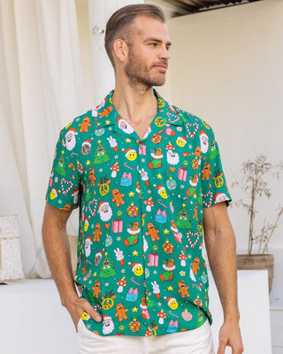 Stay festive all season long in the Holidaze shirt! Crafted from a soft rayon material, it merrily blends colourful, retro Christmas elements – from gingerbread to Santa to candy canes – all atop a festive green base. Make the holidays bright with it!