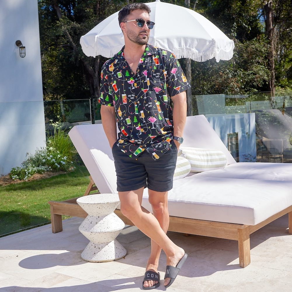 Get ready to party with the Christmas Spirits Men's Festive Shirt! Crafted from 100% rayon, it's the perfect way to show off your Yuletide jollity. With a vibrant Christmas-themed print of cocktails and twinkle lights, this shirt will have your holiday cheer up in lights!