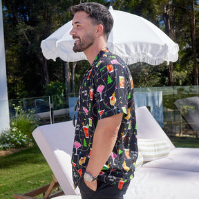 Get ready to party with the Christmas Spirits Men's Festive Shirt! Crafted from 100% rayon, it's the perfect way to show off your Yuletide jollity. With a vibrant Christmas-themed print of cocktails and twinkle lights, this shirt will have your holiday cheer up in lights!