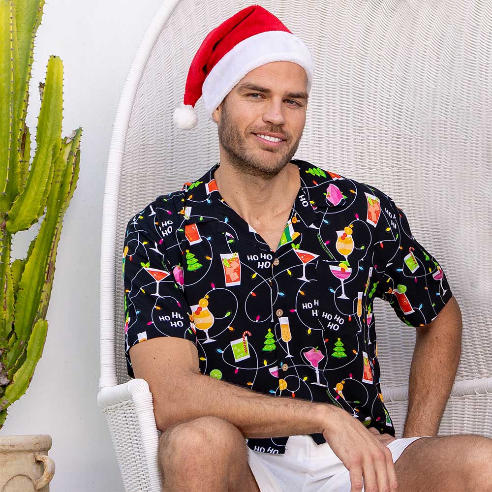 Get ready to party with the Christmas Spirits Men's Festive Shirt! Crafted from 100% rayon, it's the perfect way to show off your Yuletide jollity. With a vibrant Christmas-themed print of cocktails and twinkle lights, this shirt will have your holiday cheer up in lights!